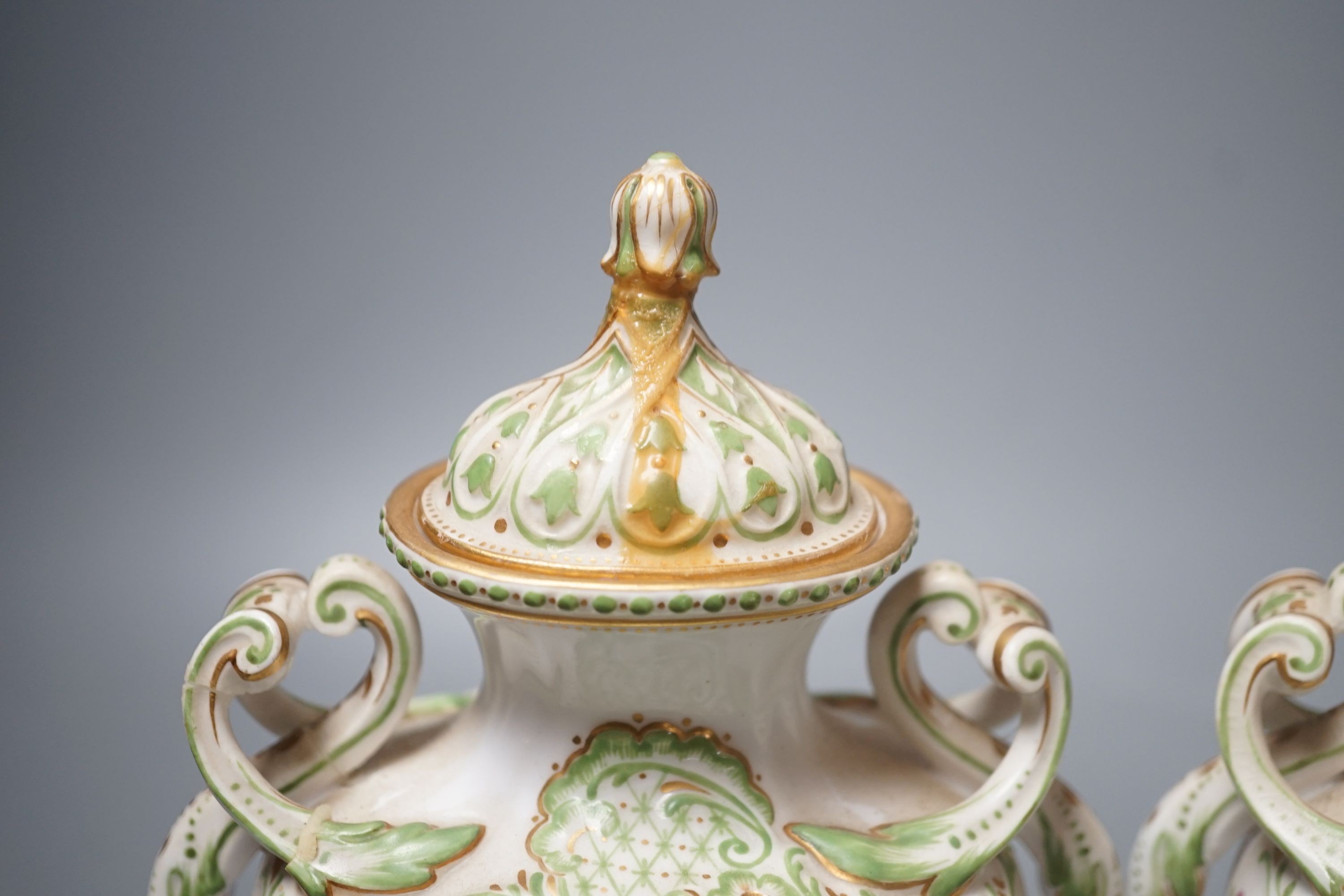 A pair of Copelands London, fruit decorated two handled vases and covers, circa 1900- 20cms high.
